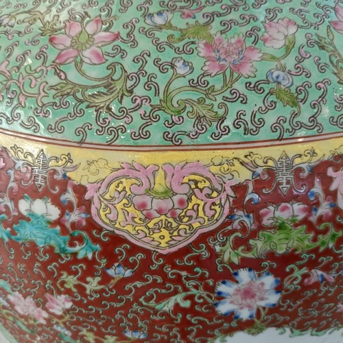 41 - A large pair of Chinese floor vases, of baluster form, decorated flowers and birds in enamel colours... 