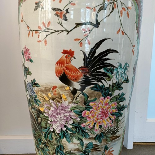 41 - A large pair of Chinese floor vases, of baluster form, decorated flowers and birds in enamel colours... 