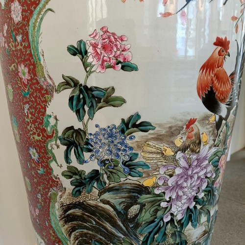 41 - A large pair of Chinese floor vases, of baluster form, decorated flowers and birds in enamel colours... 