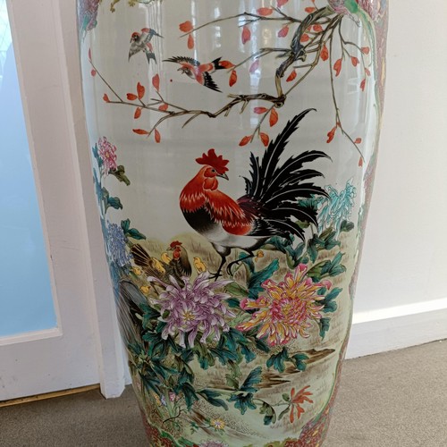 41 - A large pair of Chinese floor vases, of baluster form, decorated flowers and birds in enamel colours... 