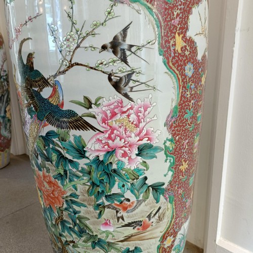 41 - A large pair of Chinese floor vases, of baluster form, decorated flowers and birds in enamel colours... 