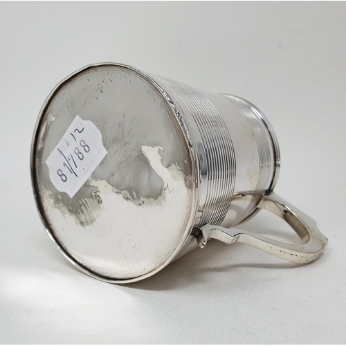 667 - An early 19th century silver mug, of tapering form, with reeded decoration, London 1823, 6.8 ozt, 8.... 