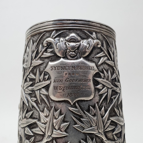 649 - A 19th century Chinese silver coloured metal mug, of tapering cylindrical form, inscribed and dated ... 