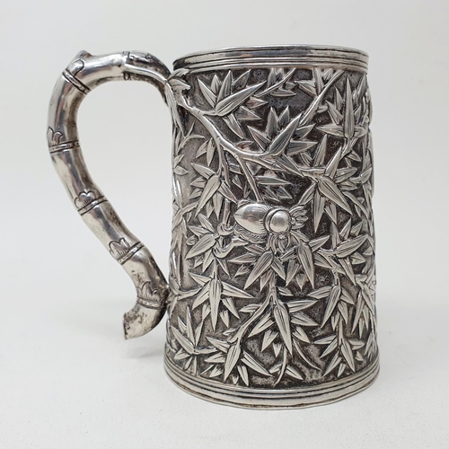 649 - A 19th century Chinese silver coloured metal mug, of tapering cylindrical form, inscribed and dated ... 