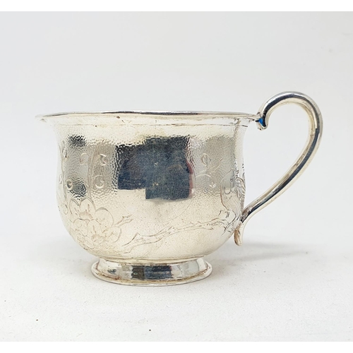 678 - A Chinese silver coloured metal cup or mug, decorated a bird and foliage, 6 cm high