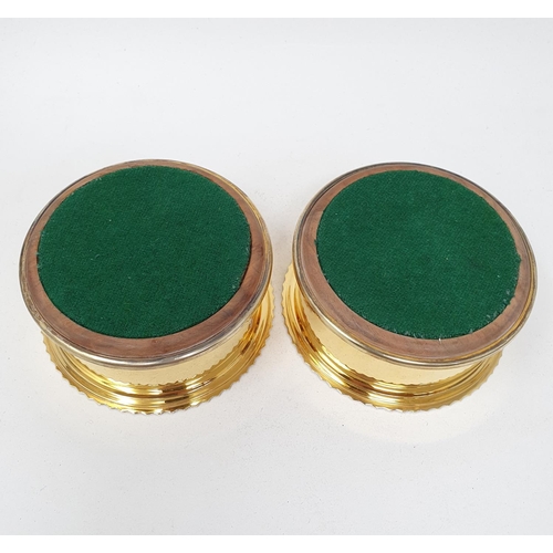 664 - A pair of George III style silver gilt wine coasters, initialled, London 1985, 11 cm diameter (2)