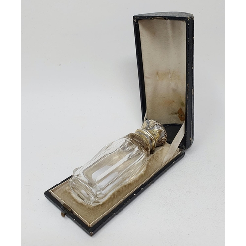 618 - A 19th century French silver gilt coloured metal and glass scent bottle, initialled, the body inscri... 