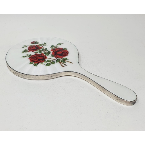 598 - A silver and enamel hand mirror, decorated roses, London 1959, 25.5 cm