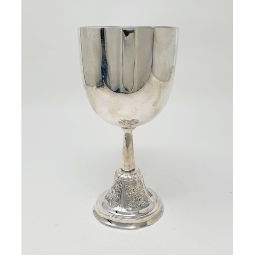 583 - A Chinese silver coloured metal goblet, of plain form, the spreading circular base decorated flowers... 