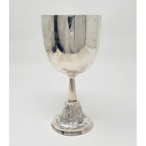 583 - A Chinese silver coloured metal goblet, of plain form, the spreading circular base decorated flowers... 