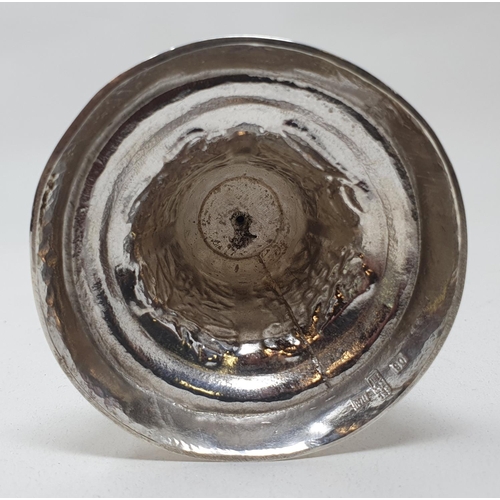 583 - A Chinese silver coloured metal goblet, of plain form, the spreading circular base decorated flowers... 