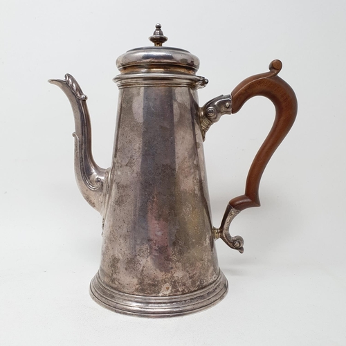 638 - A George II silver coffee pot, of tapering cylindrical form, the spout with an acanthus leaf, London... 