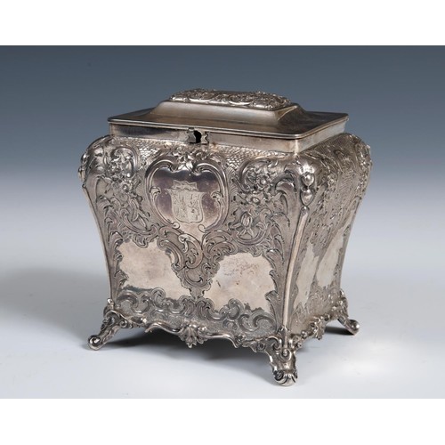 579 - A mid 19th century Scottish silver tea caddy, engraved an armorial, and embossed with flowers and fo... 