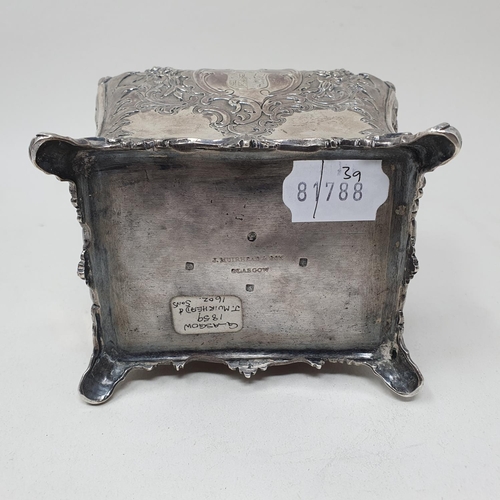 579 - A mid 19th century Scottish silver tea caddy, engraved an armorial, and embossed with flowers and fo... 