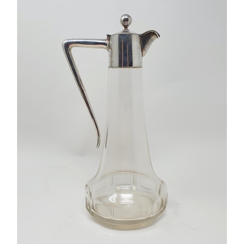 588 - A silver and glass claret jug, of tapering form, marks indistinct, 24 cm high