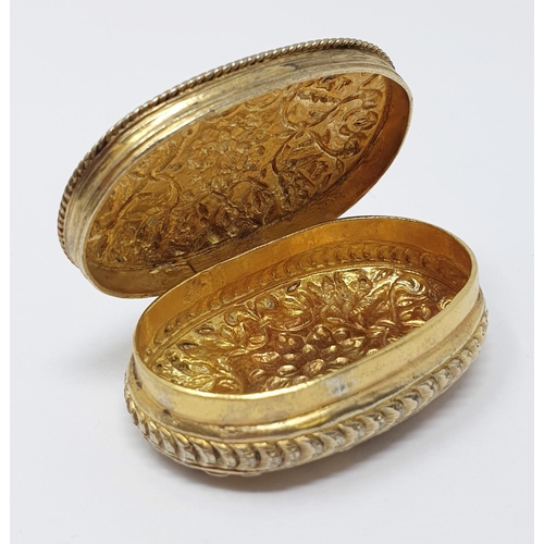 607 - A silver gilt coloured metal Continental box, of rounded rectangular form, embossed flowers and foli... 