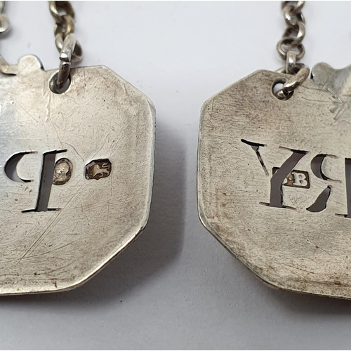 672 - An unusual pair of silver decanter labels, Sherry & Port, surmounted by cartouches which are crested... 