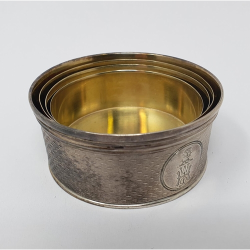 676 - A Victorian silver collapsible cup, crested and initialled, and with engine turned decoration, Londo... 