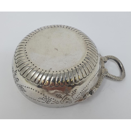 612 - A silver coloured metal wine taster, with a serpent ring handle, 11.5 cm wide