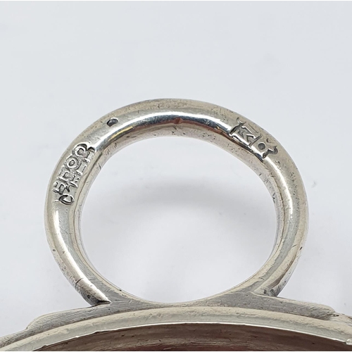 614 - An 18th century French silver wine taster, with a ring handle, 11 cm wide