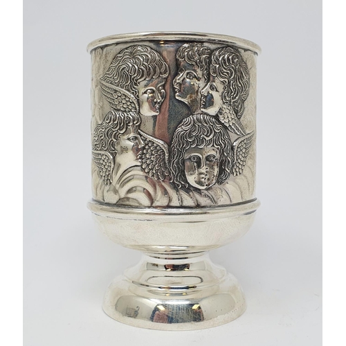 663 - A silver christening mug, decorated cherub face masks, chester 1911, 2.7 ozt, 10.5 cm high