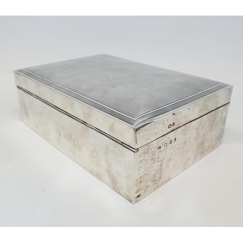 576 - A large table cigarette box, the lid with engine turned decoration, the front with a presentation in... 