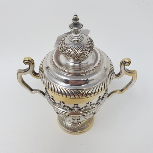 601 - A silver cup and cover, decorated face masks and strapwork , Sheffield 1931, 9.2 ozt, 15 cm high