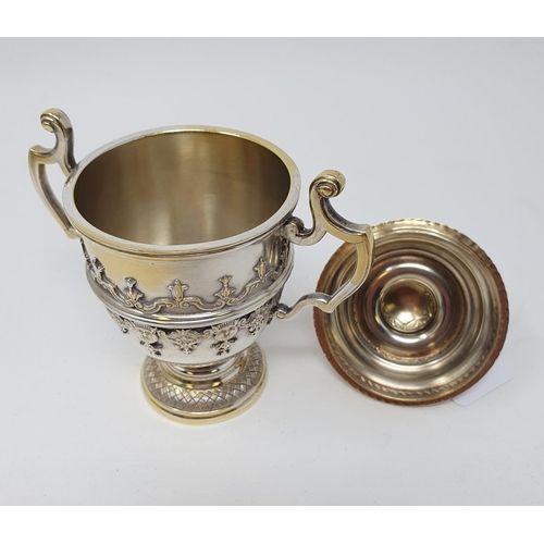 601 - A silver cup and cover, decorated face masks and strapwork , Sheffield 1931, 9.2 ozt, 15 cm high