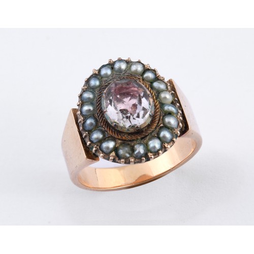 805 - An antique yellow metal, pink stone and pearl ring, ring size M