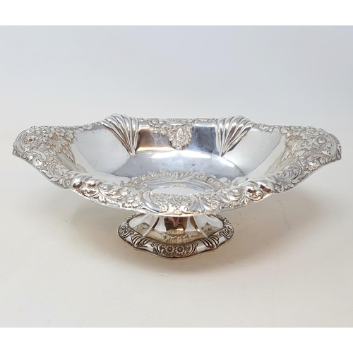 408 - A Victorian silver oval bowl, raised on a foot, with floral decoration, Chester 1895, 14.4 ozt  Prov... 