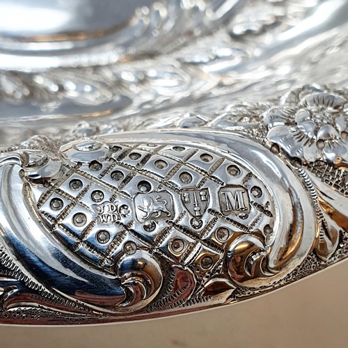 408 - A Victorian silver oval bowl, raised on a foot, with floral decoration, Chester 1895, 14.4 ozt  Prov... 