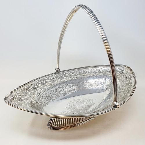 413 - A George III silver swing handled bread basket, with pierced floral decoration, London 1793, 29.54 o... 