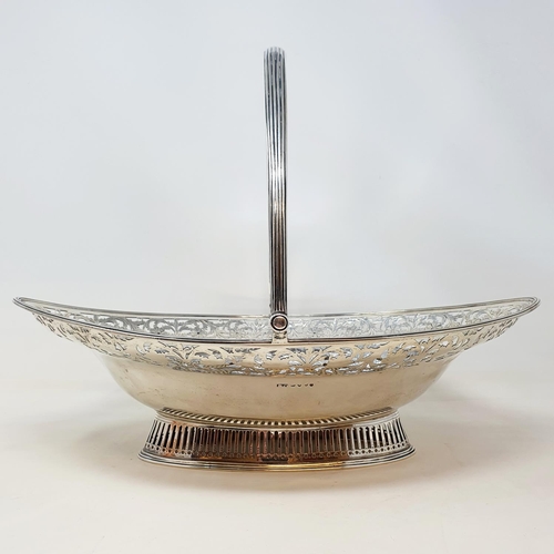 413 - A George III silver swing handled bread basket, with pierced floral decoration, London 1793, 29.54 o... 