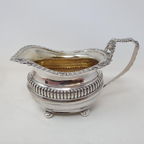 421 - An Edward VII silver sugar bowl, and a matching cream jug, Chester 1902, 15.8 ozt  (2)Provenance: Fr... 