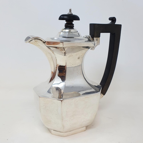 423 - A George V silver hot water jug, with ebonised handles, Birmingham 1919, all in weight 10.6 ozt  Pro... 