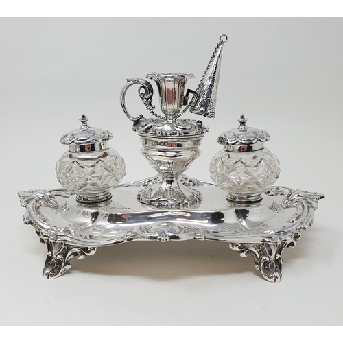 449 - An Edward VII silver desk stand, center bowl with a miniature chamber stick, flanked by cut glass in... 