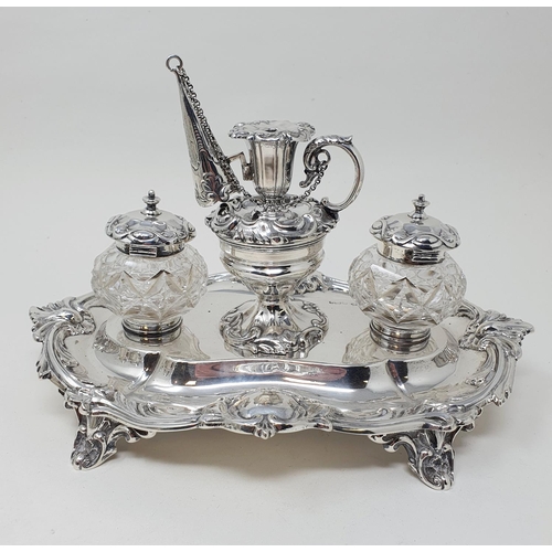 449 - An Edward VII silver desk stand, center bowl with a miniature chamber stick, flanked by cut glass in... 