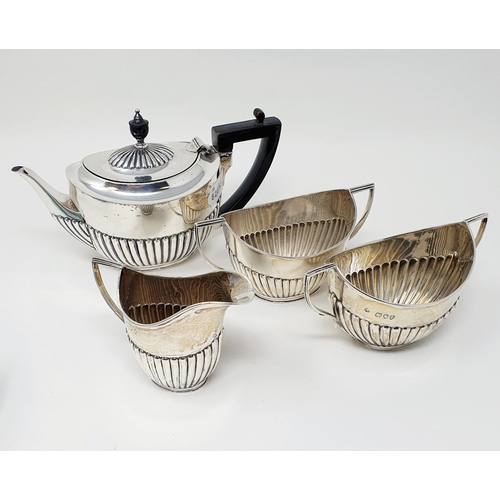 489 - A Victorian silver bachelor's tea set, London 1894, comprising a teapot, two sugar bowls and a cream... 