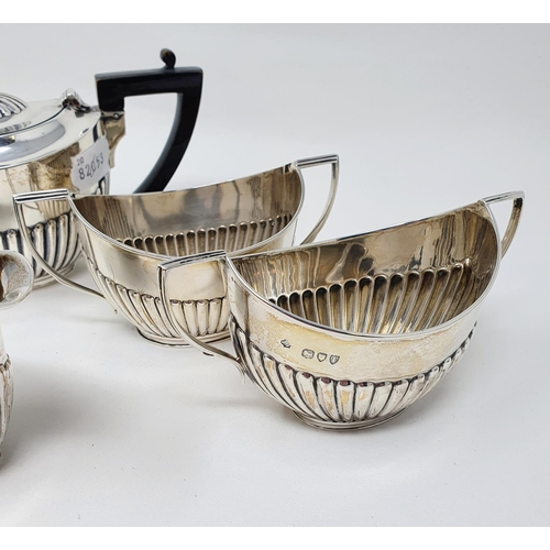 489 - A Victorian silver bachelor's tea set, London 1894, comprising a teapot, two sugar bowls and a cream... 