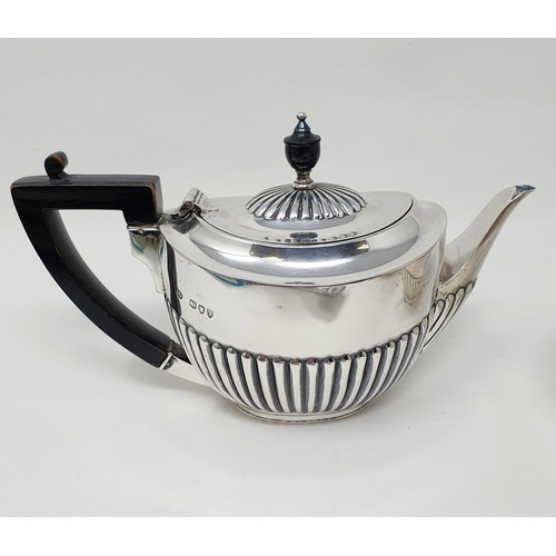 489 - A Victorian silver bachelor's tea set, London 1894, comprising a teapot, two sugar bowls and a cream... 