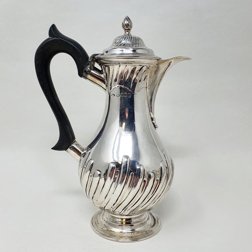 493 - A Victorian silver hot water jug, with an ebonised handle, base filled, London 1889 Provenance:  Fro... 