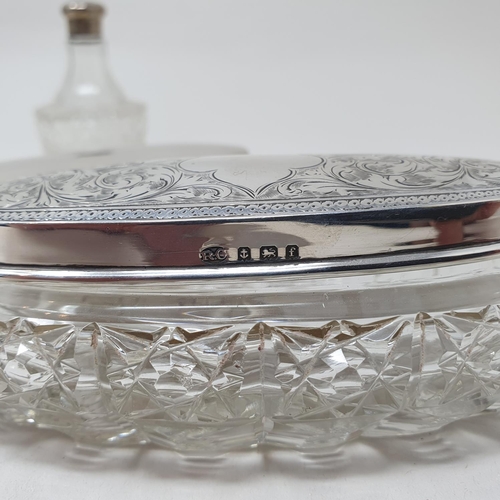 496 - A George V silver mustard pot, 2.1 ozt, and two glass boxes, with silver tops, and a glass pepperett... 