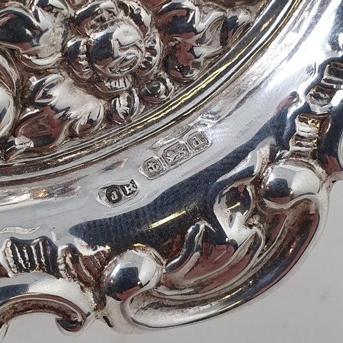 509 - A pair of silver pierced dishes, a pin dish, an oval salt and spoon, various dates and marks, 4.9 oz... 