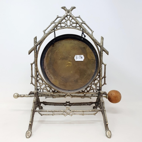 541 - A late Victorian silver plated table gong, of crabstock form, with a beater, 36 cm high