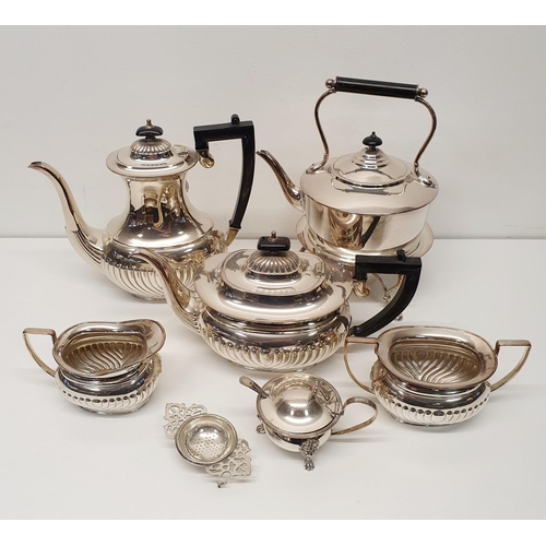 542 - A silver plated four piece tea and coffee service, a kettle on a stand, a mustard pot, a tea straine... 