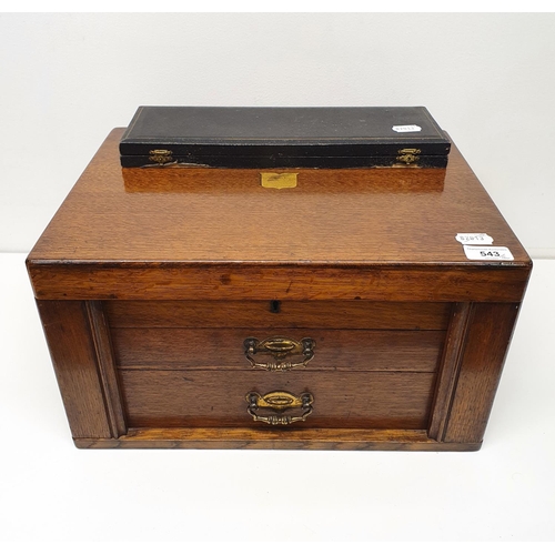 543 - A silver plated canteen of cutlery, in an oak case, with a hinged top above two drawers, note the iv... 