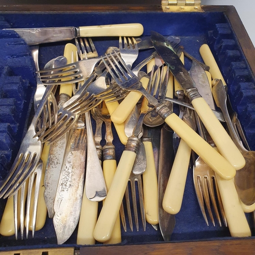 543 - A silver plated canteen of cutlery, in an oak case, with a hinged top above two drawers, note the iv... 