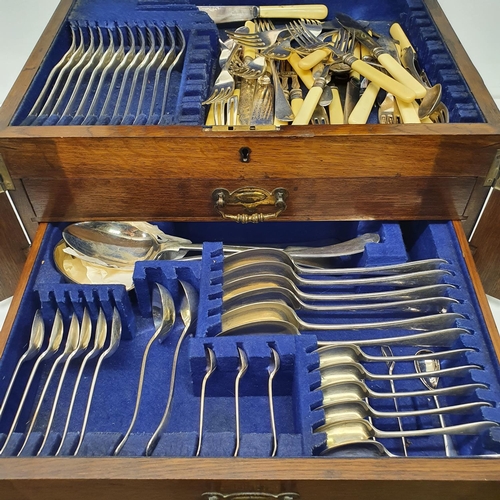 543 - A silver plated canteen of cutlery, in an oak case, with a hinged top above two drawers, note the iv... 