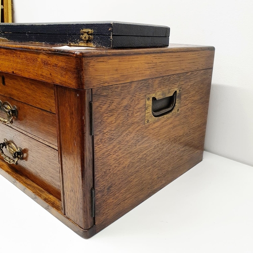 543 - A silver plated canteen of cutlery, in an oak case, with a hinged top above two drawers, note the iv... 