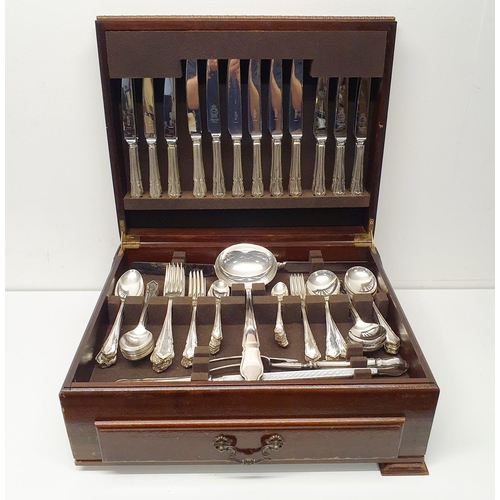 544 - A silver plated fiddle and shell pattern canteen of cutlery in a walnut case, 70 cm wide